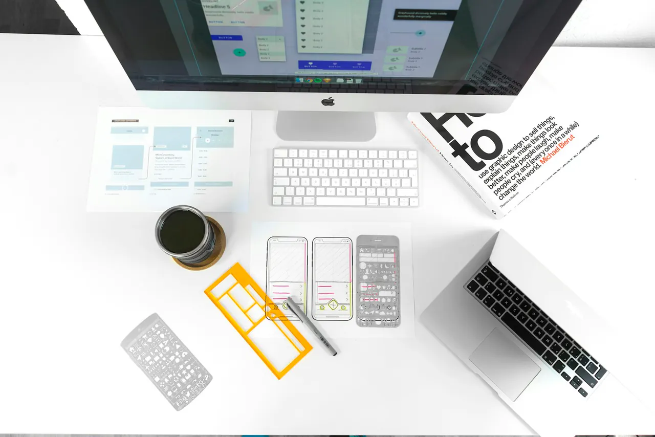 Digital design workspace with screens and creative tools