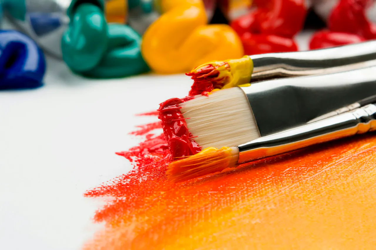 Art materials and brushes representing creative process